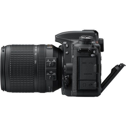 Black DSLR camera with lens on a white background