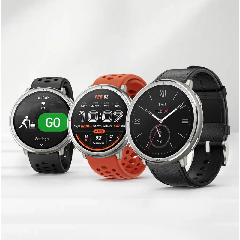 Three smartwatches with different colored bands on a white background