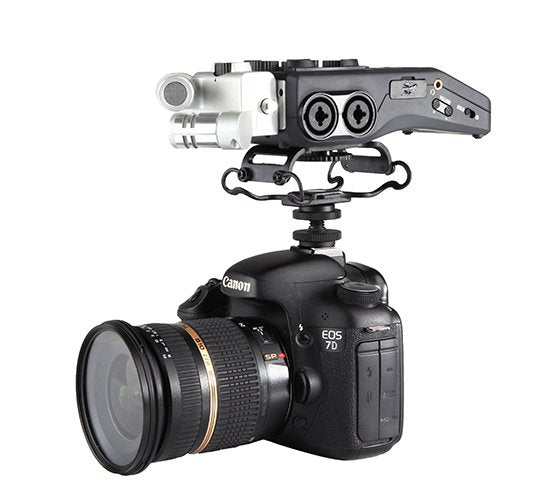 Canon EOS 7D camera with a BOYA BY-C10 Universal Microphone & Recorder Shock Mount attached on a white background