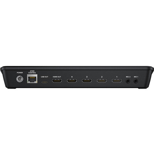 Back view of a black electronic device with various ports on a white background