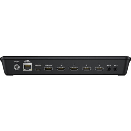 Back view of a black electronic device with various ports on a white background