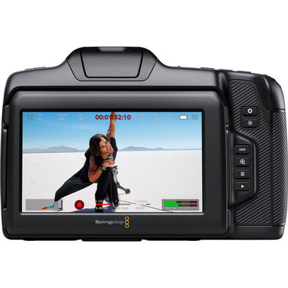 Blackmagic Design camera with screen displaying a person in a desert landscape