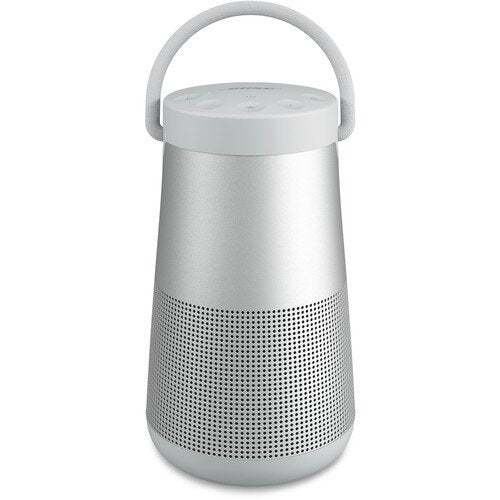 Silver portable speaker with a handle on a white background
