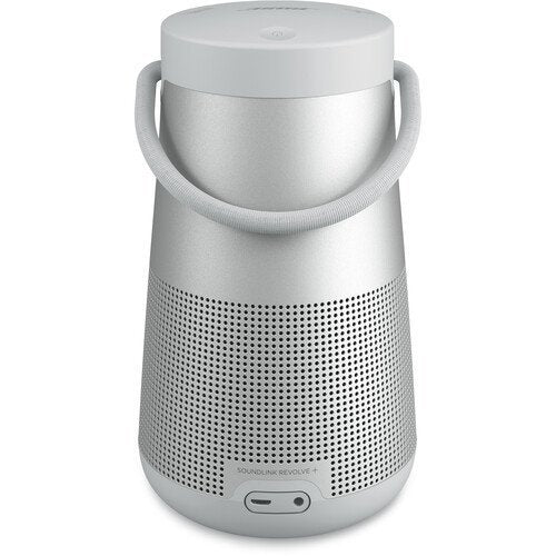 Silver portable speaker with a handle on a white background