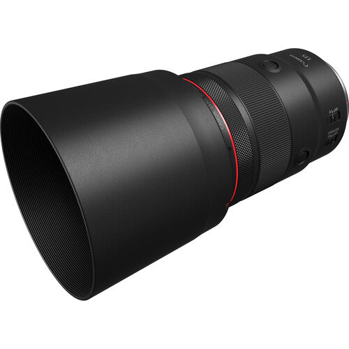 Black camera lens with red accent on a white background