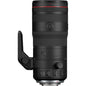 Camera lens with focus ring and control buttons on a white background