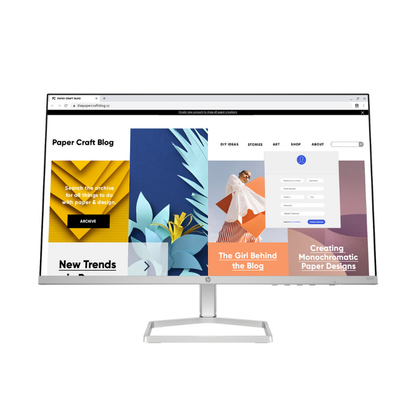 Computer monitor displaying a website with colorful design elements on a white background