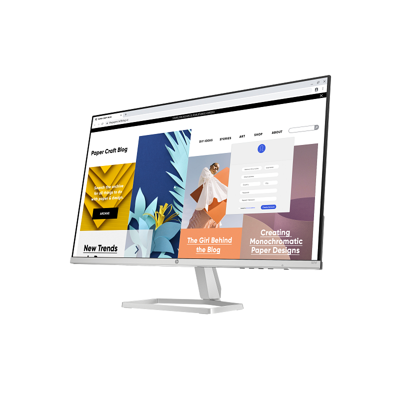 Computer monitor displaying a web page with colorful design elements on a white background