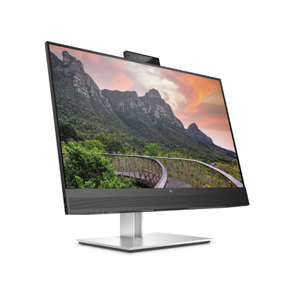 Computer monitor displaying a scenic view of mountains on a white background