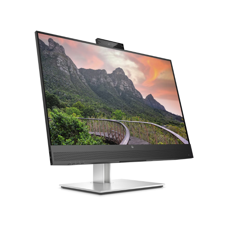 Computer monitor displaying a scenic mountain landscape on a white background