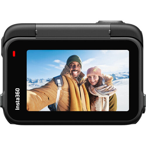 Insta360 Ace Pro Action Camera displaying a selfie of two people in a snowy landscape on its screen.