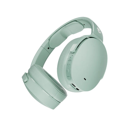 Mint green headphones on a white background
