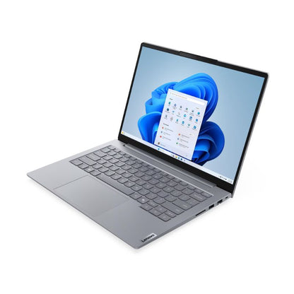 Laptop with a blue flower on the screen on a white background