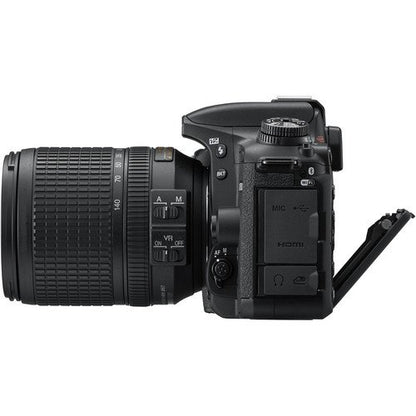 Black DSLR camera with lens on a white background