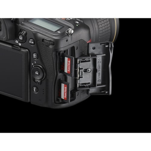 Camera body with memory card slots on a black background