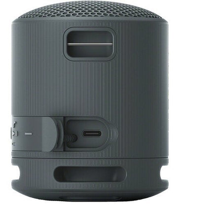 Gray portable speaker with control buttons on a white background