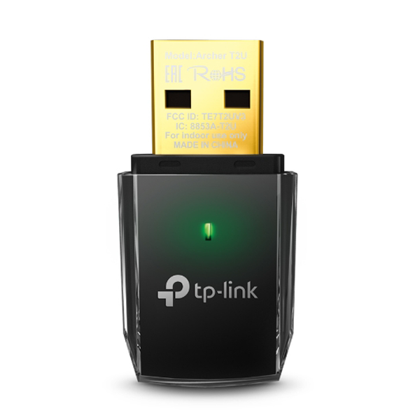 TP-Link USB adapter with green light on a white background