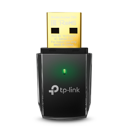 TP-Link USB adapter with green light on a white background