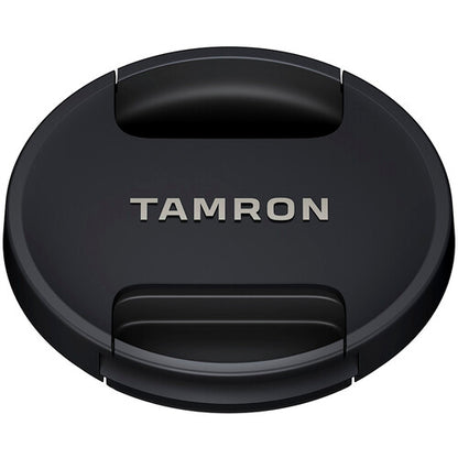 Black camera lens cap with 'Tamron' branding on a white background